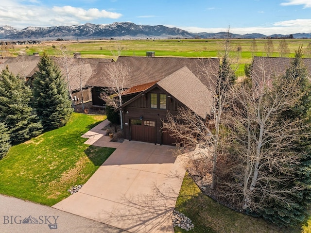 birds eye view of property with a rural view and a mountain view
