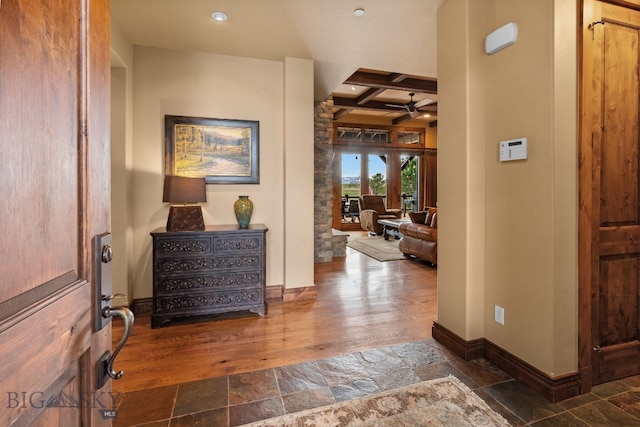 foyer entrance with ceiling fan, stone tile floors, recessed lighting, beamed ceiling, and coffered ceiling
