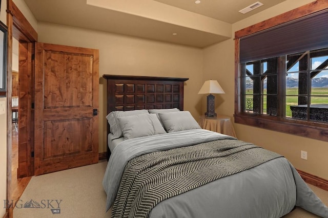 bedroom featuring visible vents and carpet flooring