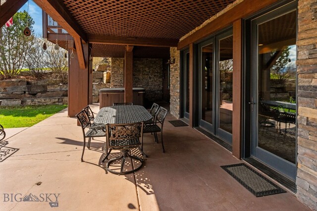 96 Highnoon Way, Bozeman, MT 59718 - view of patio / terrace with outdoor dining area, a hot tub, and central air condition unit