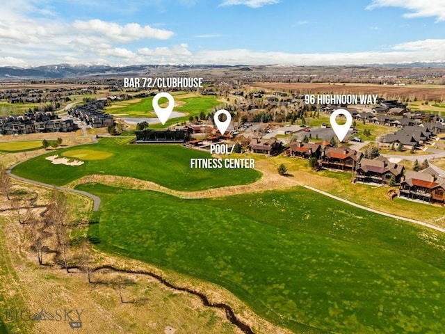 bird's eye view featuring a residential view, a mountain view, and view of golf course