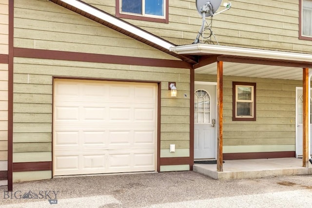 property entrance with an attached garage