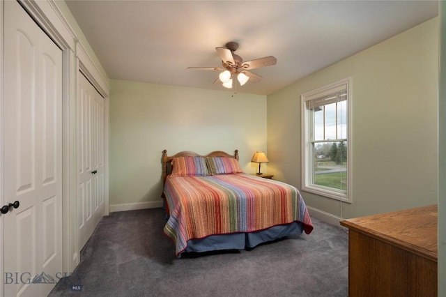 carpeted bedroom featuring baseboards and ceiling fan
