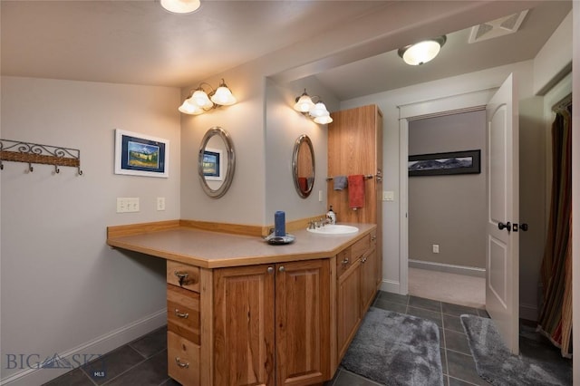 bathroom with tile patterned floors, visible vents, baseboards, and vanity