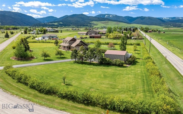 birds eye view of property featuring a mountain view and a rural view
