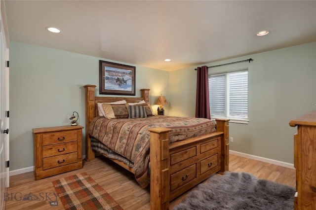 bedroom with recessed lighting, baseboards, and light wood-type flooring