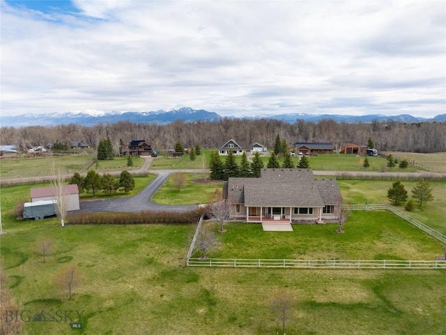birds eye view of property featuring a mountain view and a rural view