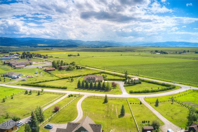 birds eye view of property featuring a mountain view and a rural view