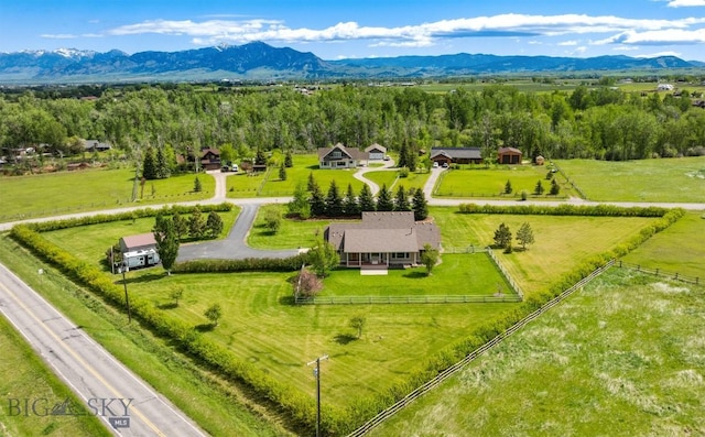 birds eye view of property with a mountain view and a rural view