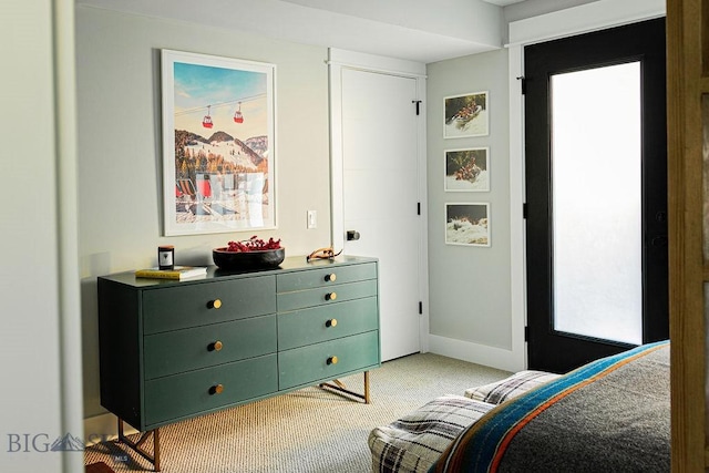 bedroom featuring light carpet