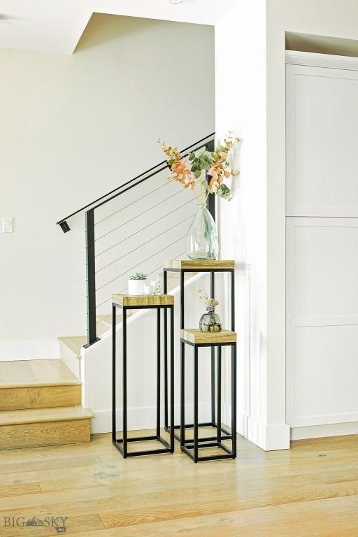 stairway featuring wood finished floors