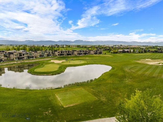 view of community with a water and mountain view, view of golf course, and a residential view