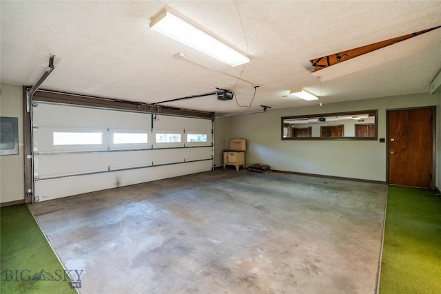 423 Riverview Ct, Great Falls, MT 59404 - garage featuring a garage door opener and electric panel
