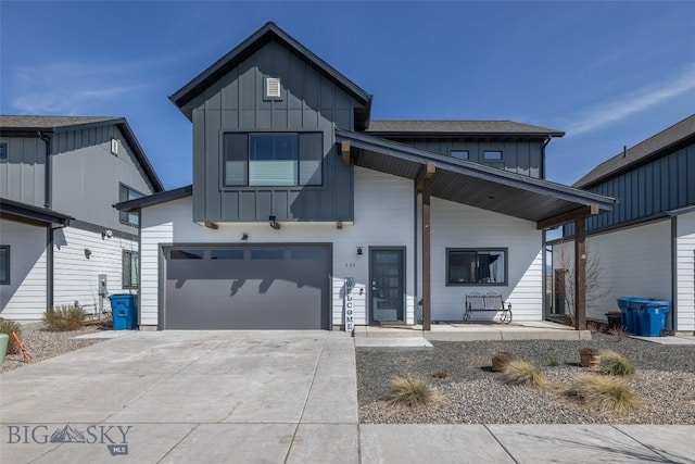 131 Stallion, Bozeman, MT 59718 - modern inspired farmhouse featuring a porch, an attached garage, board and batten siding, and driveway