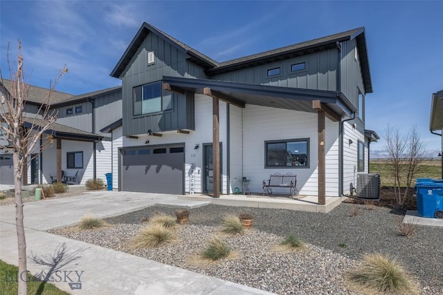 view of front of home with covered porch, central AC unit, board and batten siding, concrete driveway, and an attached garage