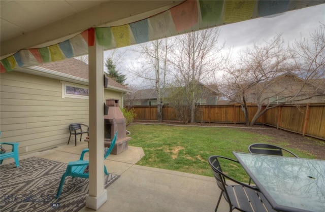 view of patio featuring a fenced backyard and outdoor dining space