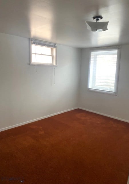716 13th Ave S, Bozeman, MT 59715 - spare room featuring baseboards and carpet