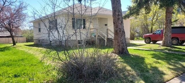 716 13th Ave S, Bozeman, MT 59715 - view of home's exterior with a yard