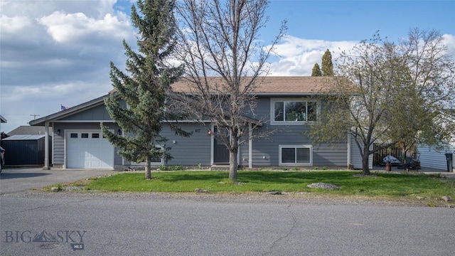 417 Henry Dr, Belgrade, MT 59714 - view of front of property with aphalt driveway, a front yard, and a garage