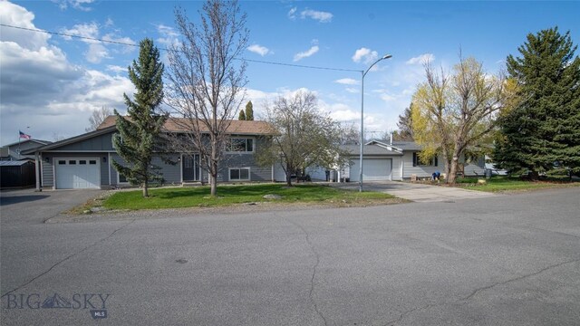 417 Henry Dr, Belgrade, MT 59714 - view of front of property featuring asphalt driveway, an attached garage, and a front yard
