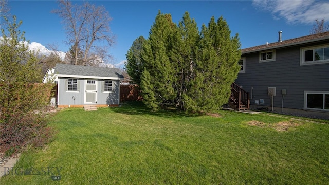 417 Henry Dr, Belgrade, MT 59714 - view of yard with a storage unit, an outdoor structure, fence, and stairway