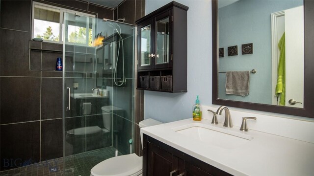 417 Henry Dr, Belgrade, MT 59714 - full bathroom featuring vanity, toilet, and a shower stall