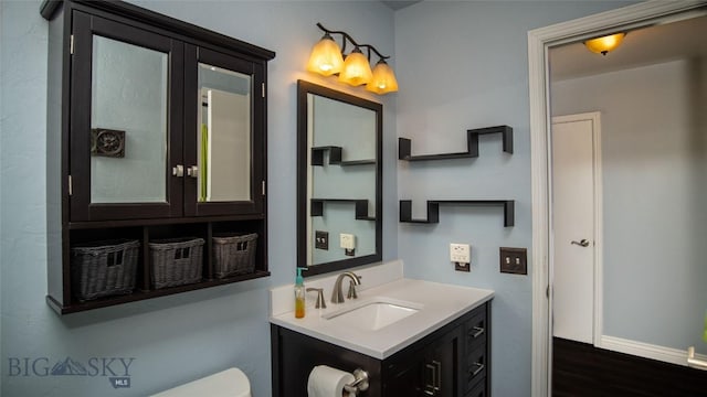 417 Henry Dr, Belgrade, MT 59714 - half bath with vanity and wood finished floors