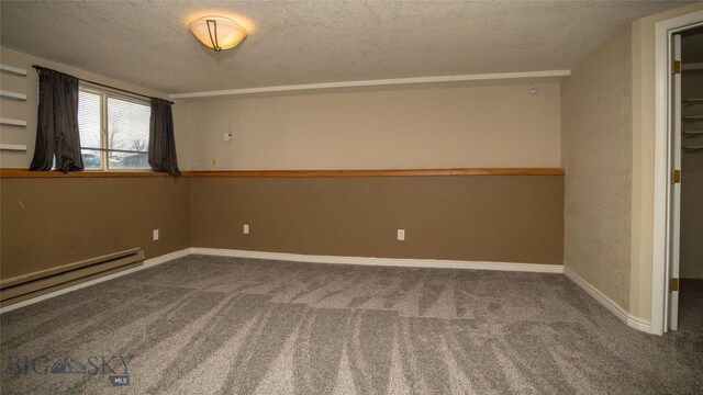 417 Henry Dr, Belgrade, MT 59714 - unfurnished room with baseboards, carpet, a baseboard heating unit, and a textured ceiling