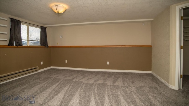 417 Henry Dr, Belgrade, MT 59714 - empty room featuring baseboard heating, carpet floors, and a textured ceiling