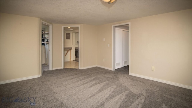 417 Henry Dr, Belgrade, MT 59714 - empty room with carpet, a textured ceiling, and washer / dryer