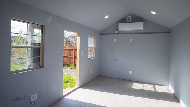 417 Henry Dr, Belgrade, MT 59714 - carpeted empty room featuring a wall mounted AC, vaulted ceiling, and recessed lighting