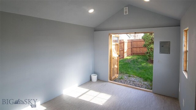 417 Henry Dr, Belgrade, MT 59714 - doorway featuring vaulted ceiling, carpet flooring, electric panel, and recessed lighting