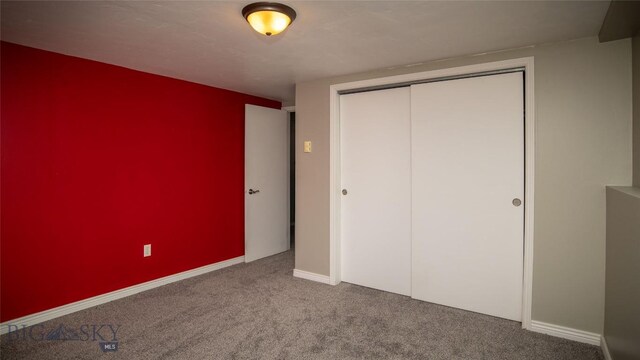 417 Henry Dr, Belgrade, MT 59714 - unfurnished bedroom with baseboards, carpet, and a closet