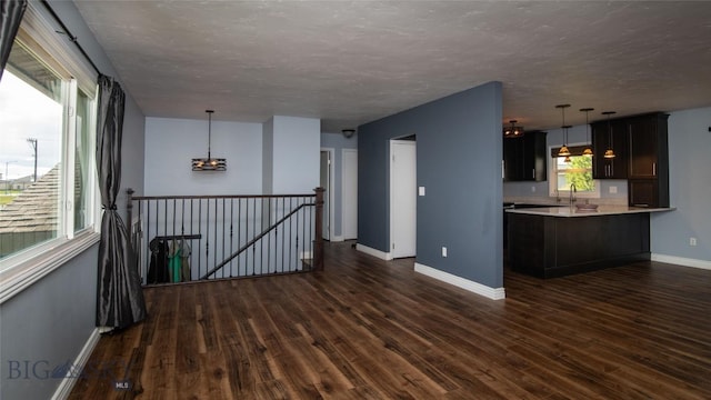 417 Henry Dr, Belgrade, MT 59714 - empty room with dark wood-style floors and a textured ceiling