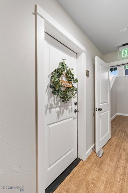 interior space with light wood-type flooring and baseboards