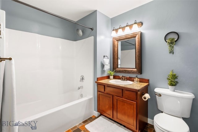 full bath featuring vanity, toilet, and shower / washtub combination