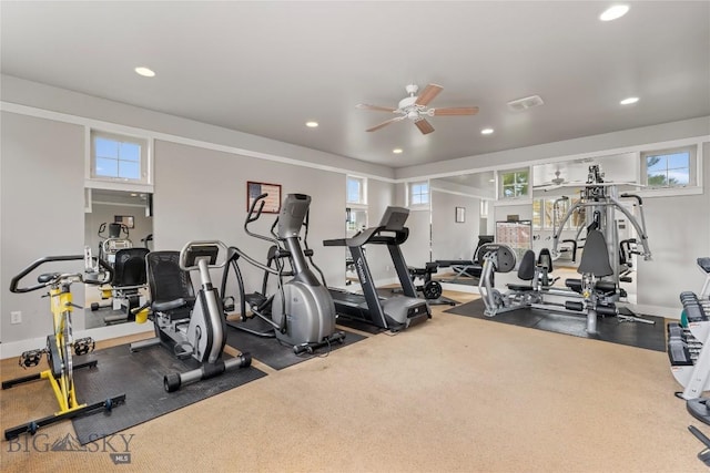 gym with a ceiling fan, baseboards, recessed lighting, and a healthy amount of sunlight