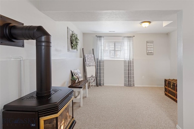 interior space featuring baseboards and carpet flooring