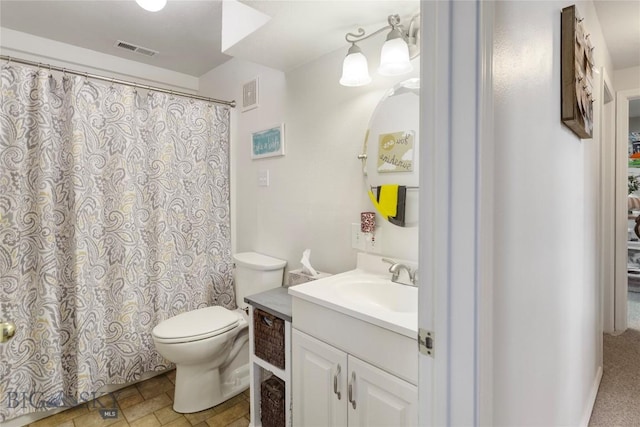 bathroom featuring vanity, toilet, curtained shower, and visible vents
