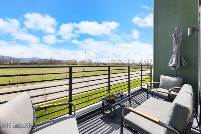 balcony with a mountain view and a rural view