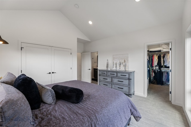bedroom with a closet, light colored carpet, high vaulted ceiling, recessed lighting, and a spacious closet