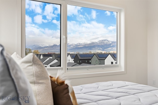 bedroom featuring a mountain view