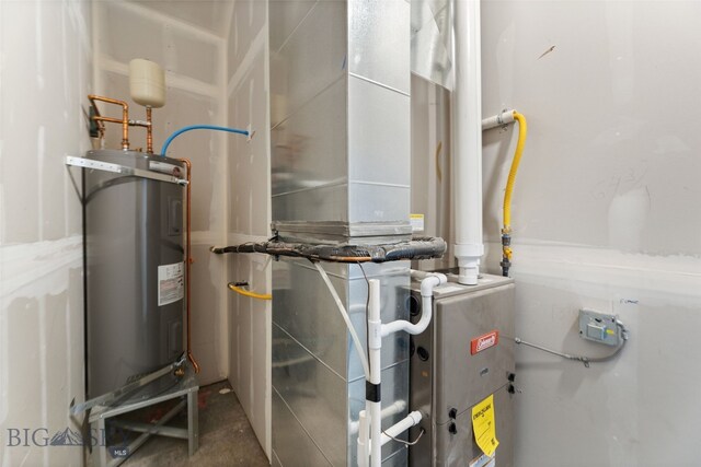 utility room with electric water heater