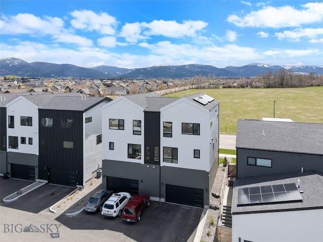 birds eye view of property with a residential view and a mountain view