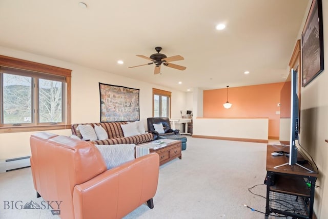living area with baseboards, ceiling fan, light colored carpet, recessed lighting, and a baseboard heating unit