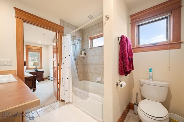 bathroom with tile patterned flooring, shower / tub combo with curtain, vanity, toilet, and baseboards