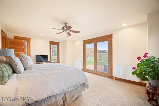 carpeted bedroom featuring access to outside, recessed lighting, radiator, and ceiling fan