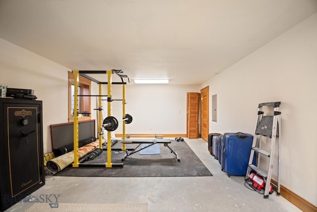 exercise room with baseboards