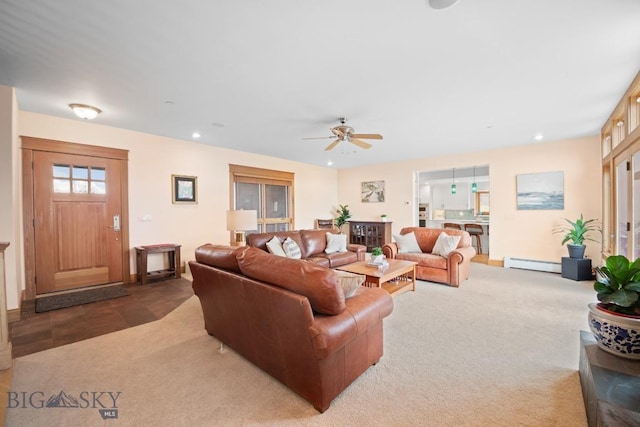 living area with a ceiling fan, recessed lighting, carpet, and a baseboard radiator