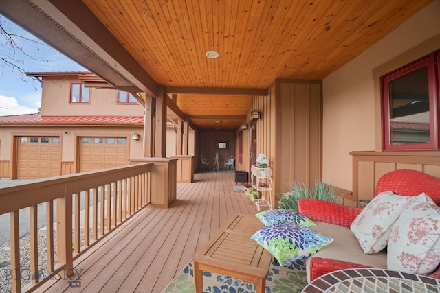 wooden terrace with a garage